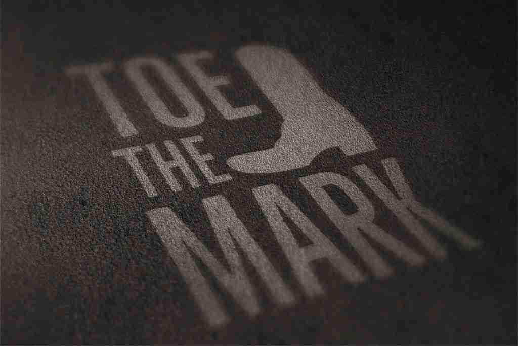 Toe The Mark Logo